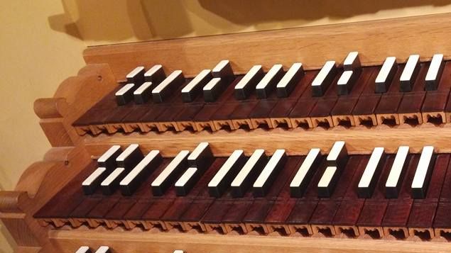 It is sometimes possible to tell by looking at the keyboards of an older historic organ the sort of tuning/temperament for which it was built.
This photo, for example, shows a 3-manual Renaissance organ keydesk having a compass of four octaves, a broken octave in the bottom with split sharps at F# and G#, and split sharps in the midrange at Eb.
Old historic instruments were commonly tuned in 1/4 (quarter)-comma meantone temperament [See blog, Temperaments & Tuning, Part IV], and in these instruments the bottom octaves of the manuals typically were provided with a short octave with split sharps.
In this particular instrument (photo) F# and G# keys also were provided for the short octave at the bottom and throughout the manual compass, indicating that this organ was most likely built to be tuned in meantone but in a way in which more sharp keys were usable than in quarter-comma -- something such as 1/5-comma 1/6-comma meantone (