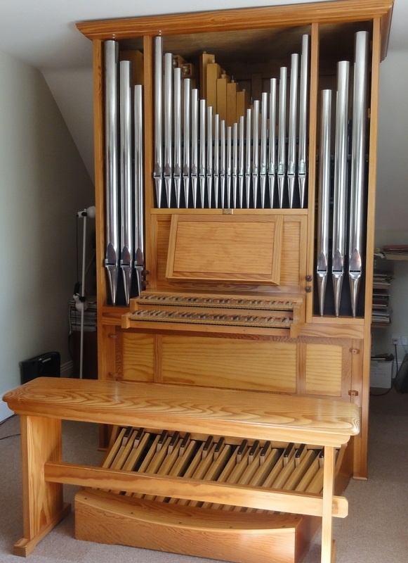 A compact house pipe organ with mechanical action and only 2 ranks of real pipes can make a wonderful practice desk.
If there's room for it in the residence, this is the real McCoy.