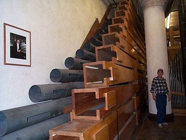 Sometimes the lowest octave of a rank of pipes in the organ, which is normally fixed in a vertical position on the windchest, is mounted horizontally, the pipes stacked one upon another, to make the most use of the available space.
Photo shows the 32 foot Contra Gamba (metal) and 32 foot Contra Diaphone (wood) of the String Pedal division of the Wanamaker Grand Court organ, Philadelphia, PA, the largest fully functional pipe organ in the world.