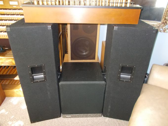RIGHT SIDE EXTERNAL SPEAKER SYSTEM SHOWING  VELODYNE/BSR SUBS (center bottom), BSR COLOSSUS CABS RETROFIT WITH NEW DRIVERS (center top), AND CONN PIPES SITTING ATOP PEAVEY CABS