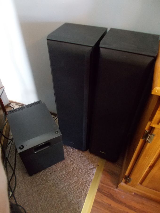 REAR EXTERNAL SPEAKER SYSTEM SHOWING SONY SUB AND PAIRED TOWER CABS