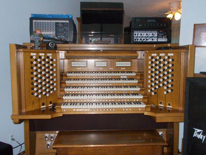 CONSOLE SHOWING POWER MIXERS, AMPS, DUAL GRAPHIC EQUALIZER, AND LAMP W/BLACK EYESHADE SITTING ATOP